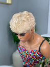 Glueless pixie cut wig with precision-cut bangs, offering a polished and sophisticated style.