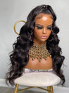 natural glueless long curly wig providing luxurious, bouncy curls with ponytail