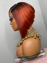 Razor cut bob wig with feathered edges for a soft, voluminous effect.