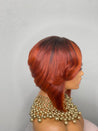 Razor cut bob wig with feathered edges for a soft, voluminous effect.